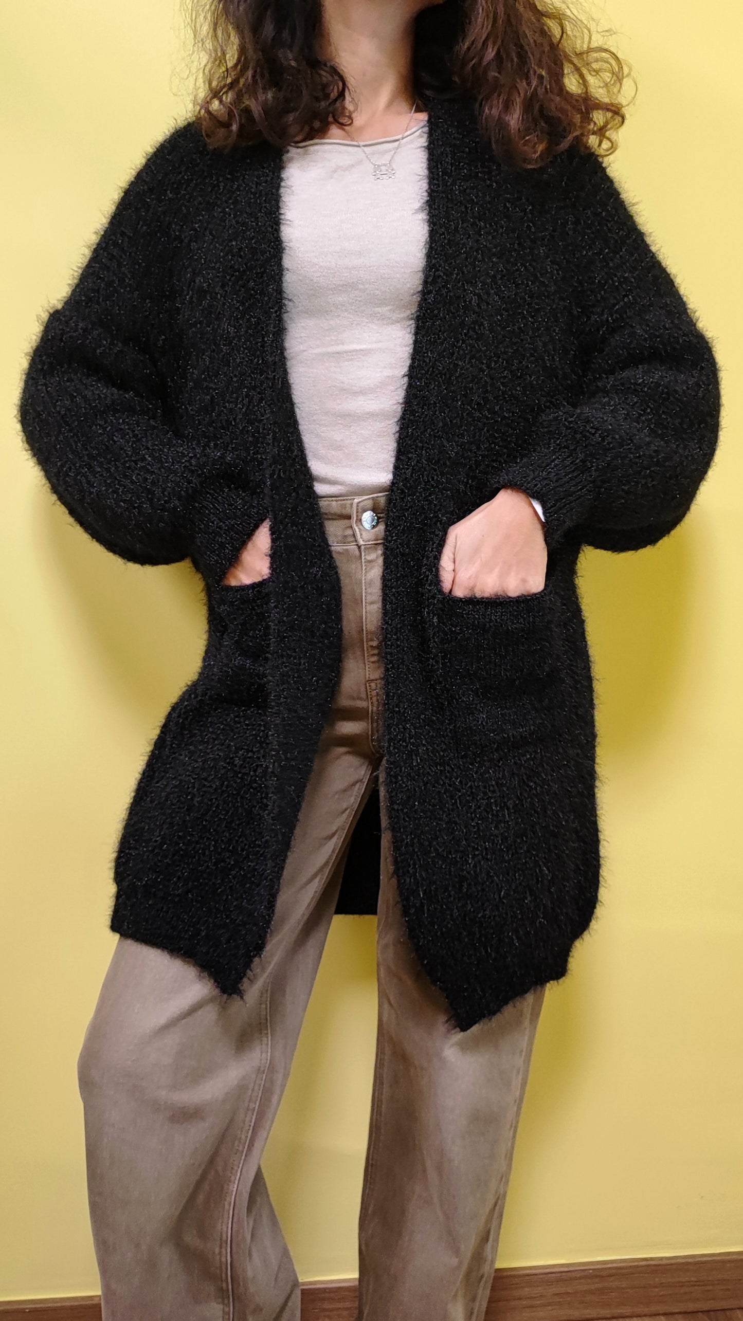 Cardigan peluche con tasche