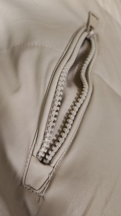 Piumino lungo smanicato beige